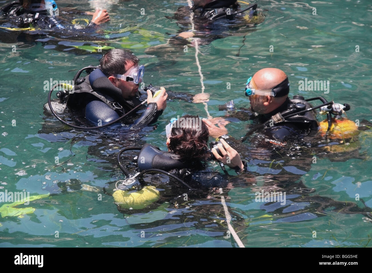 Scuba divers preparing for the dive. Stock Photo