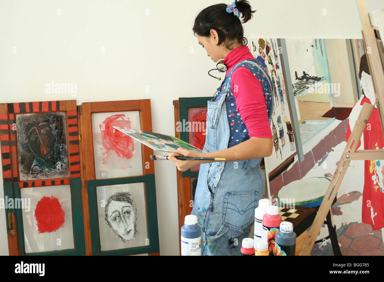 young painting artist on work Stock Photo Alamy