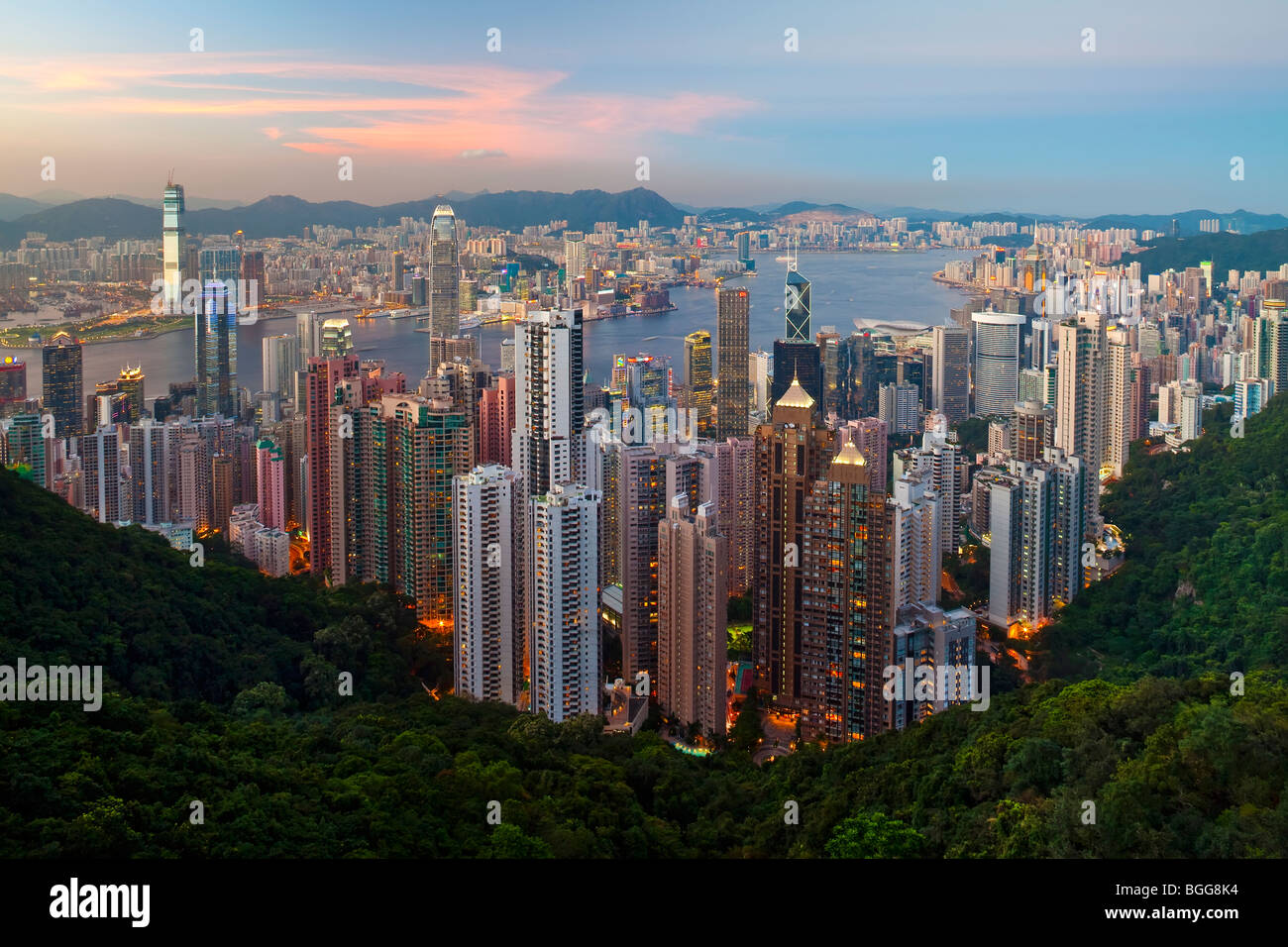 China, Hong Kong, Victoria Peak. View over Hong Kong from Victoria Peak. The illuminated skyline of Central sits below The Peak Stock Photo