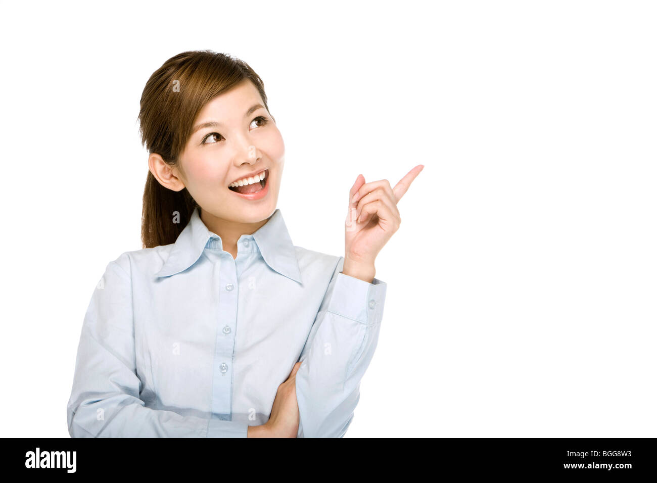 Young smiling woman pointing finger hi-res stock photography and images ...