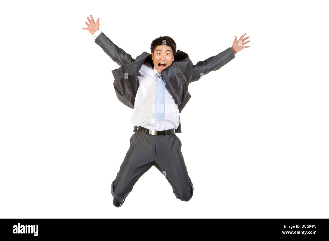 Young businessman falling down from the sky Stock Photo