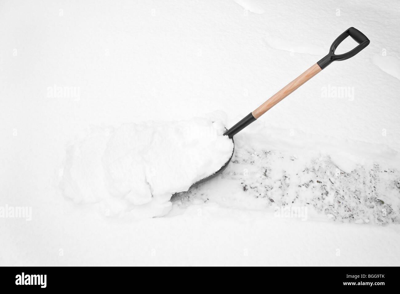 Snowscene, snow shovel in deep snow Stock Photo