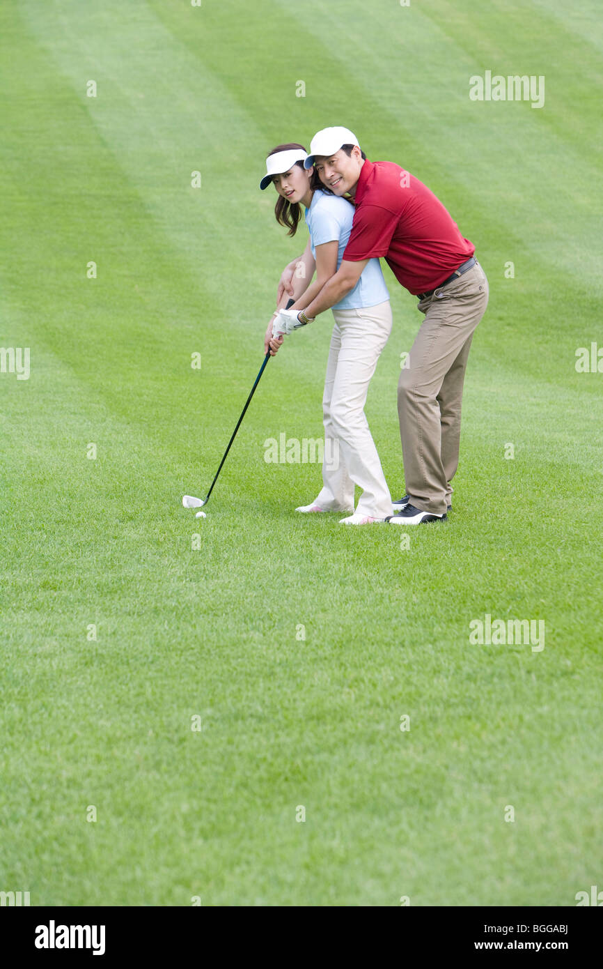 Golf coach teaching playing golf Stock Photo Alamy