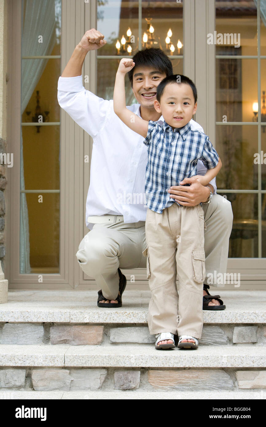 Father son flexing muscles hi-res stock photography and images - Alamy