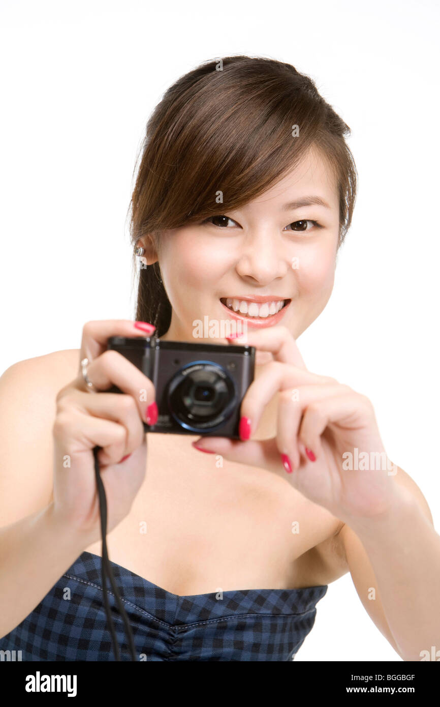 Young woman using digital camera Stock Photo - Alamy