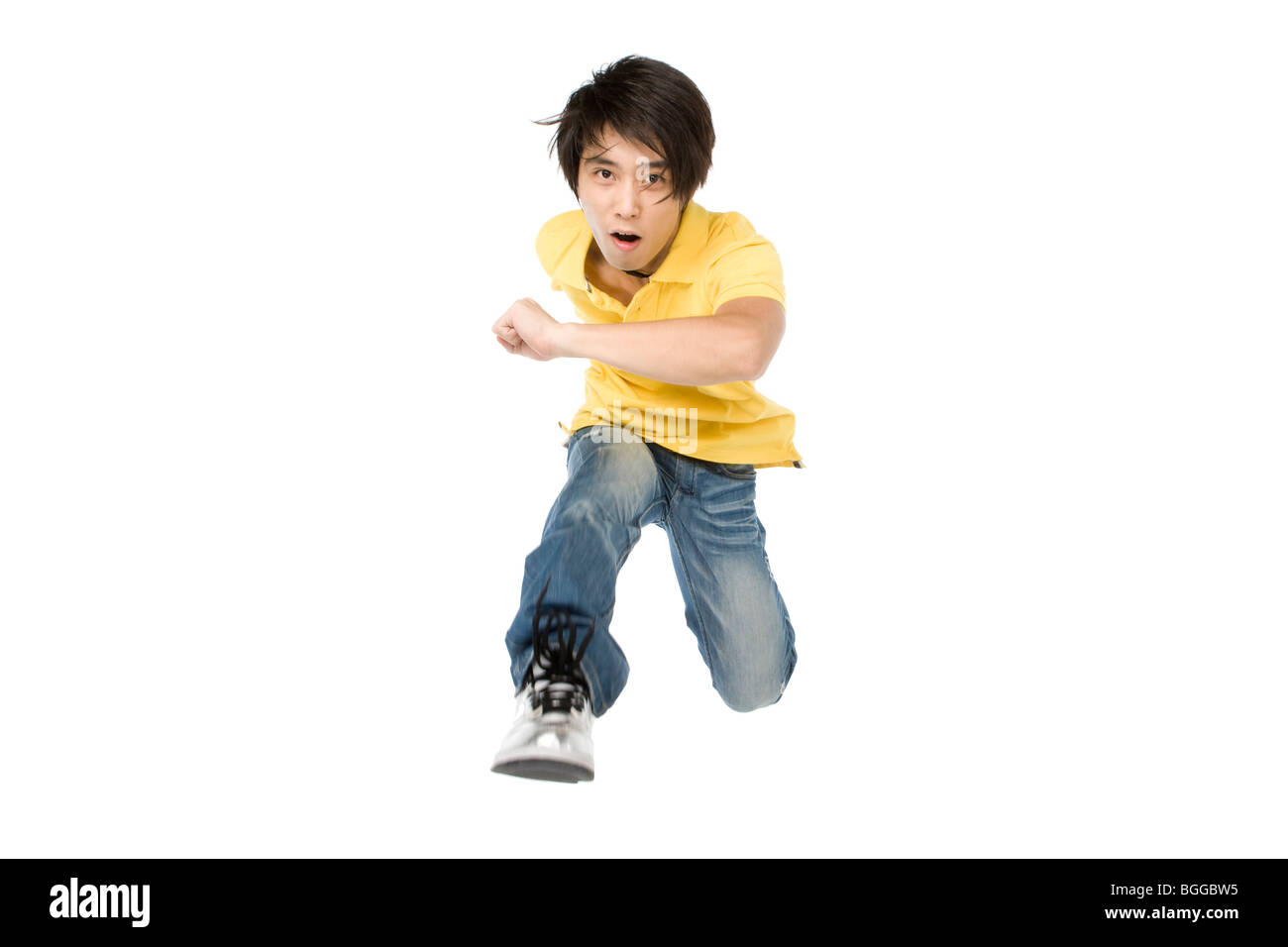 Young man running forward Stock Photo Alamy