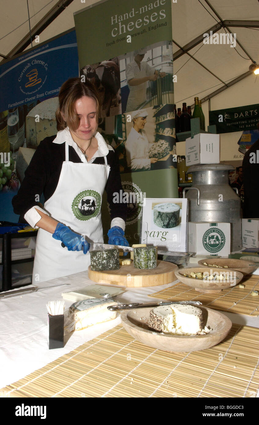 serving cheese at farmers market Stock Photo