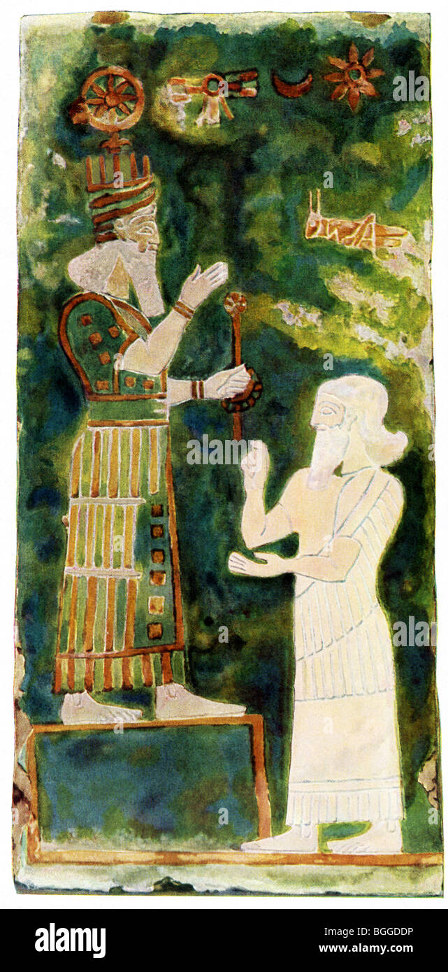 Sargon (left) pays homage to the Assyrian god Asur.  This wall painting decorated brick tile in a house in Assur. Stock Photo