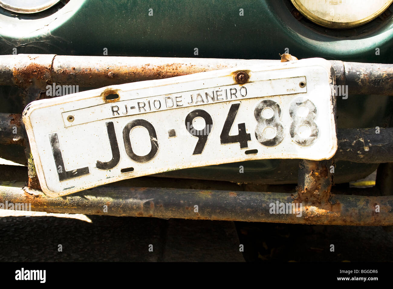 A Rio de Janeiro numberplate hangs loose on the rusting bumber of one of the thousands of Beetles in South America Stock Photo