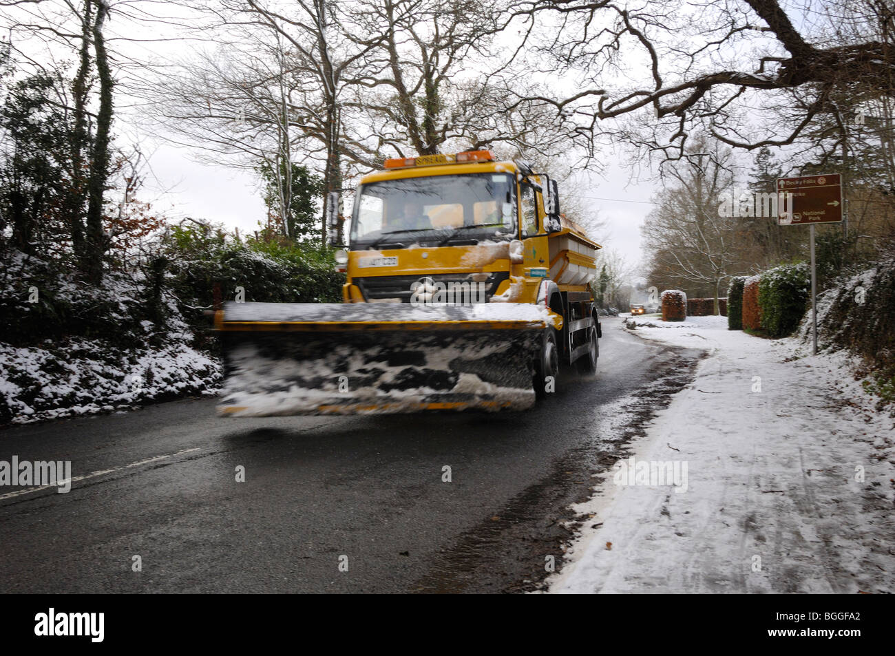Snowplough clearing road near Bovey Tracey Dartmoor national Park Devon England Stock Photo