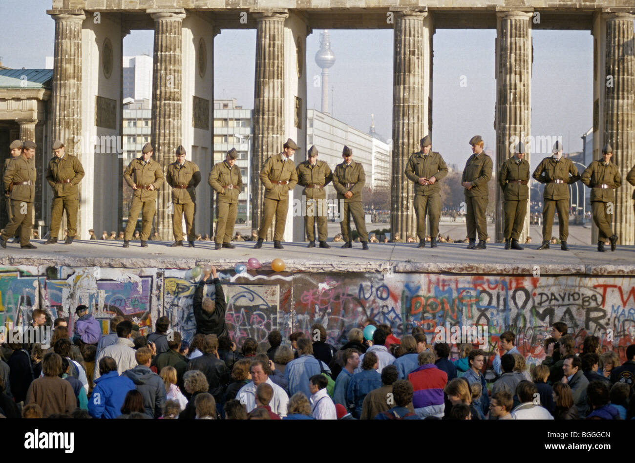 Fall of the Berlin Wall: Soldiers saving the wall at the Brandenburg Gate, Berlin, Germany Stock Photo