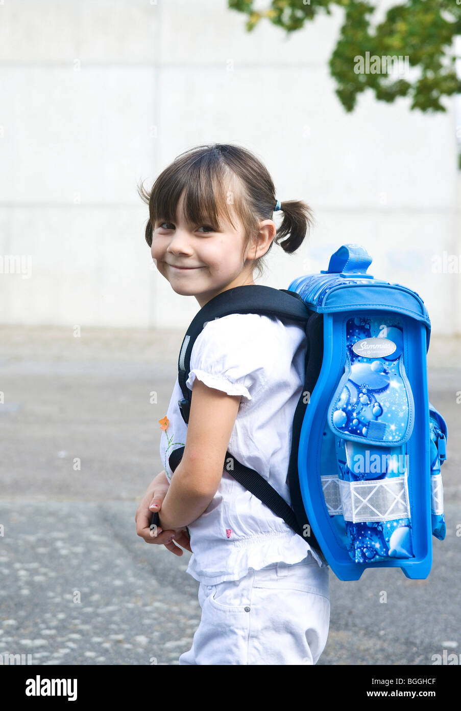 Girl carrying school bag, side view Stock Photo - Alamy