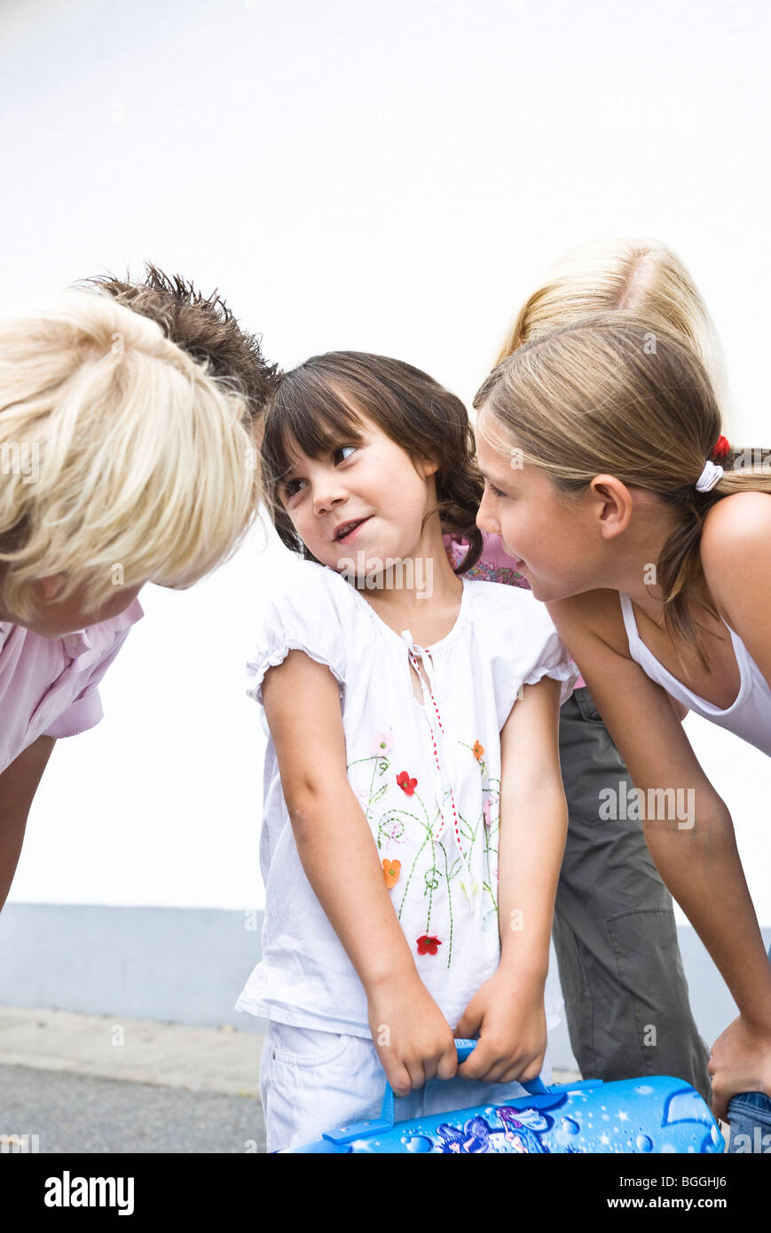 Children listening to a little girl Stock Photo
