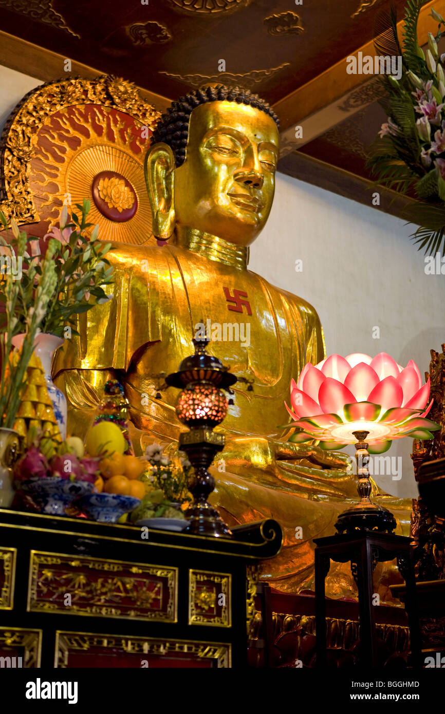 Altar with a statue of Buddha in a temple, Vietnam, low angle view