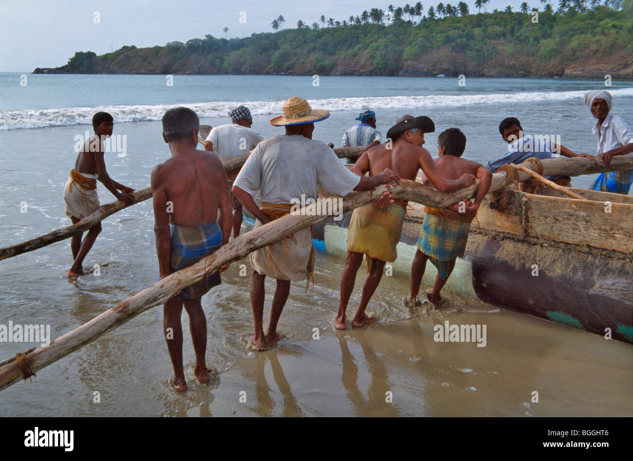 Fisherman pulling the fishing boat, Weligama, Sri Lanka Stock Photo
