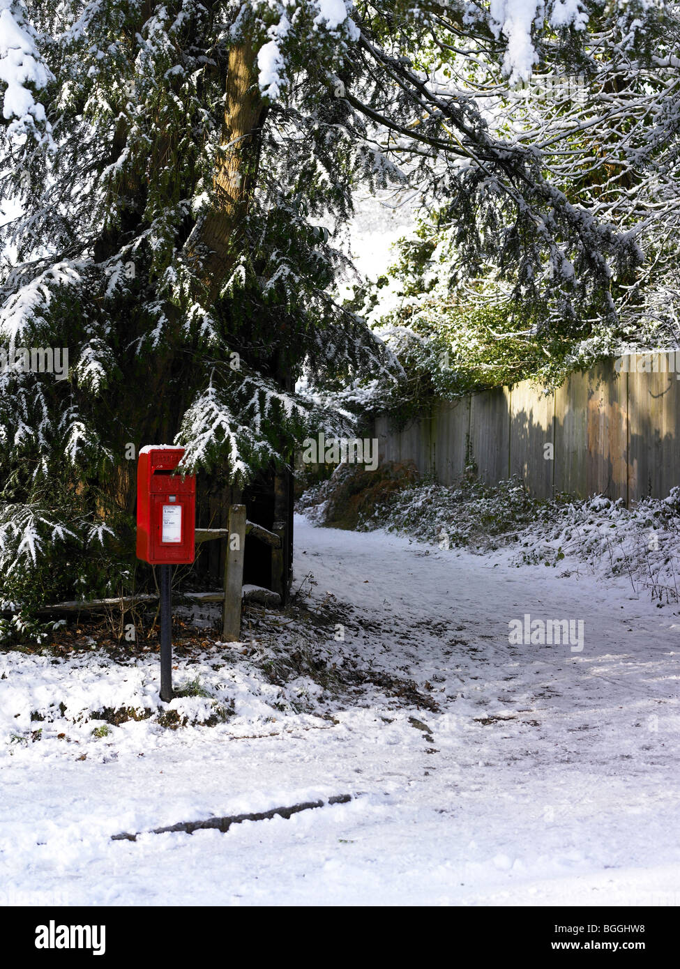 A red post box in the snow Stock Photo - Alamy