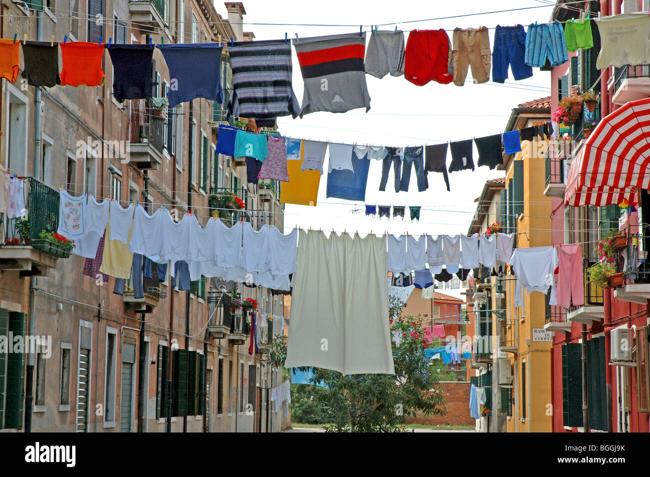 Laundry drying on clotheslines between two buildings, Giudecca, Venice