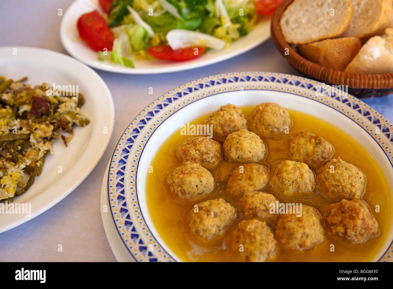 Stew, Meatballs, scrambled and asparagus salad, typical gastronomy of Almedinilla, Cordova, Andalusia, Spain Stock Photo