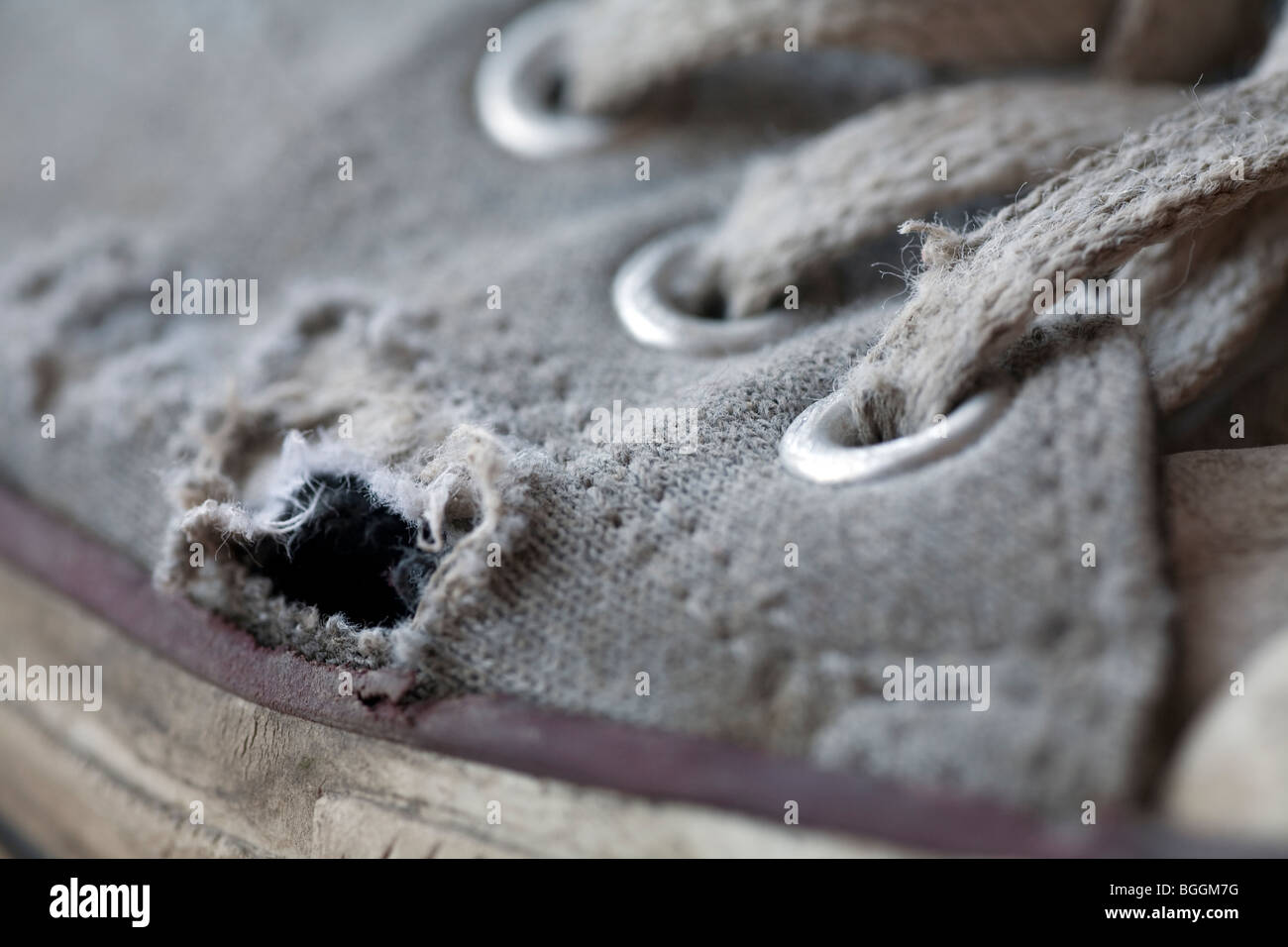 Detailed image showing wear and tear on a pair of Converse training shoes after some months of use Stock Photo