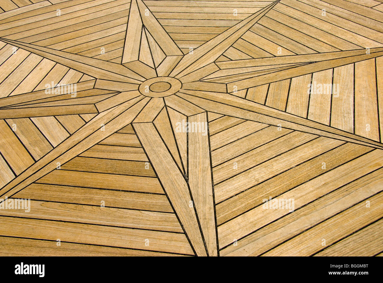 Inlaid wooden deck star design on cruise ship Stock Photo - Alamy