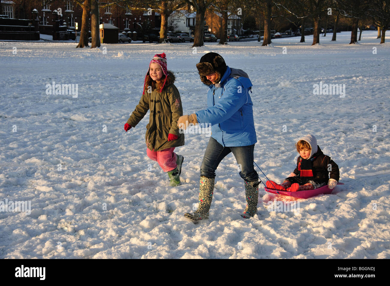 Sledging on The Long Walk in winter snow, Windsor Castle, Windsor, Berkshire, England, United Kingdom Stock Photo