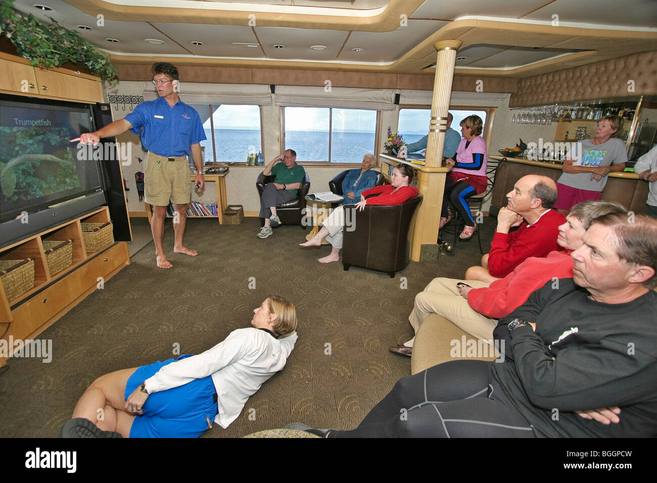 Expedition leader Kevin Martin gives talk on fish in cruise ship lounge. Sea of Cortez, Baja California, Mexico Stock Photo