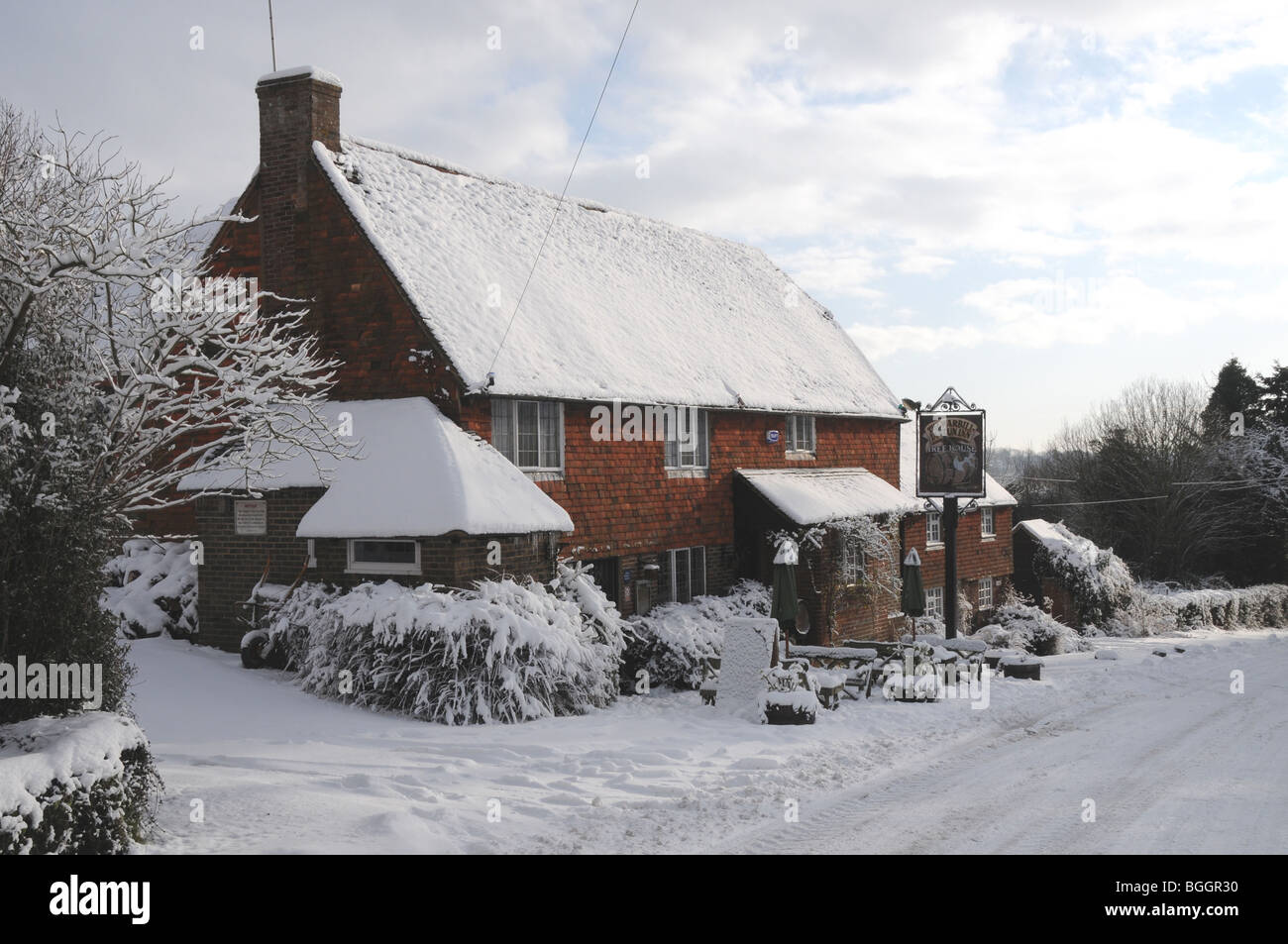 Snow at the Warbill-in-Tun inn in the hamlet of Warbleton, East Sussex. Stock Photo