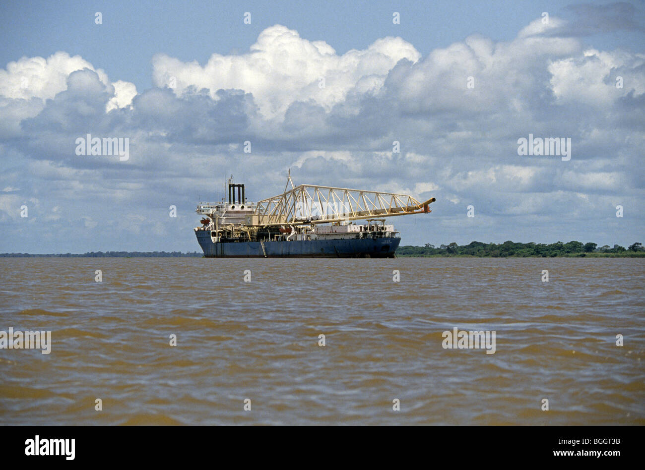 The Cuidad Bolivar, A small replenishment oiler ship in the channel of the Orinoco River in Venezuela Stock Photo