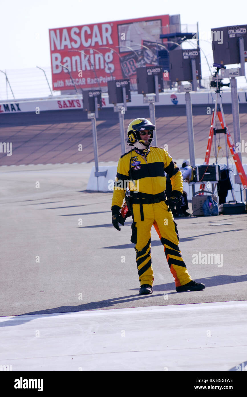 A NASCAR track official stands ready during the qualifying of the Sept. 26, 2009 Las Vegas 350 Camping World Truck Series race. Stock Photo