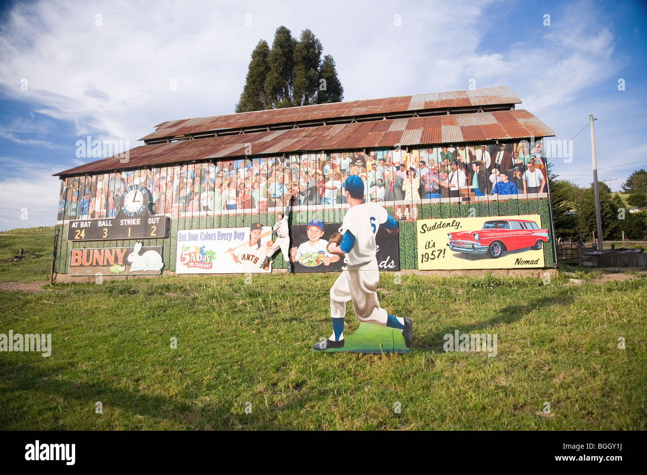 Old barn with nostalgic baseball signs and mural off Route 101, Central