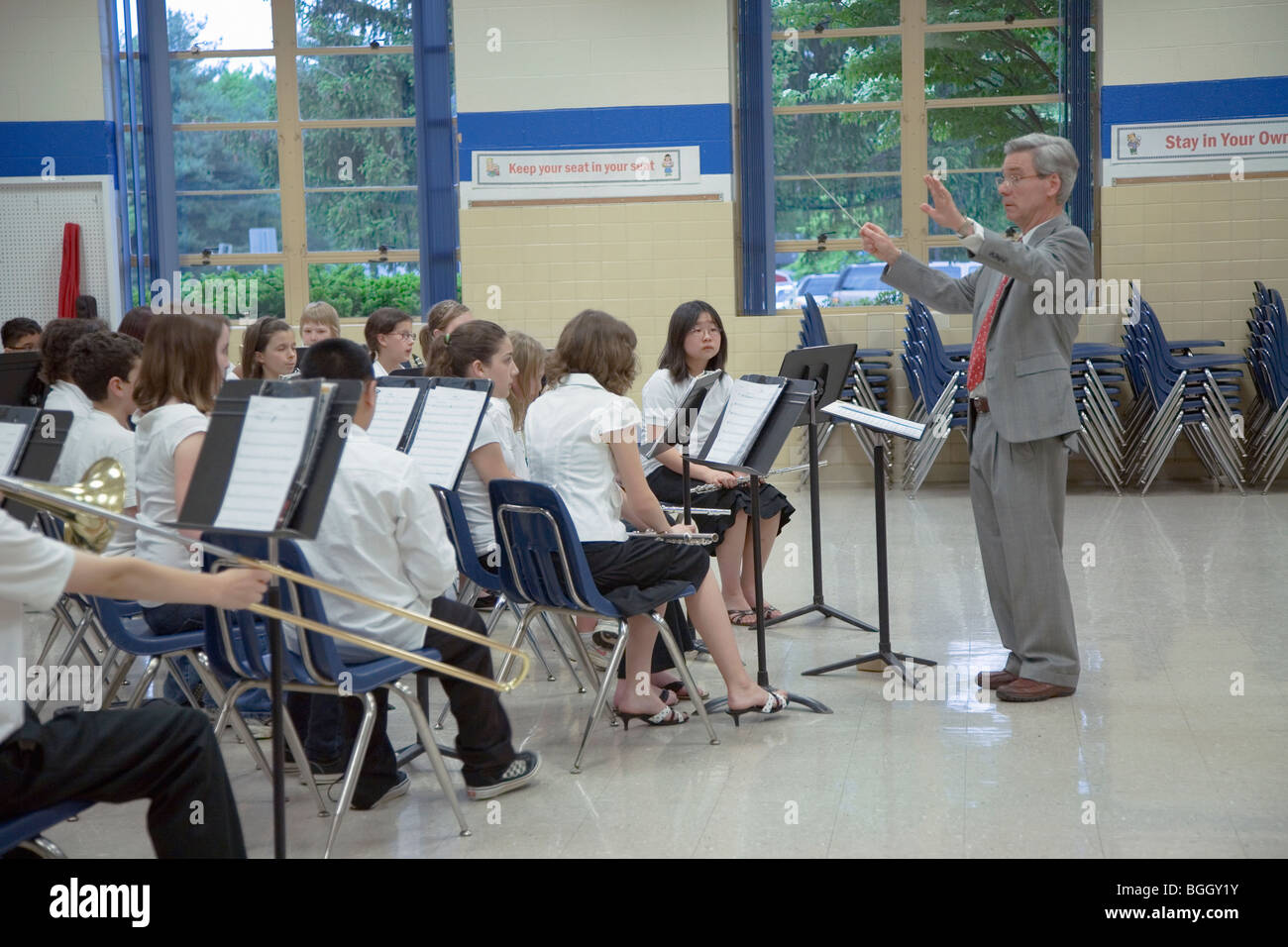 Grade school band conductor leads school 5th grade band recital at Ravensworth Elementary, Fairfax County, Springfield, Virginia Stock Photo