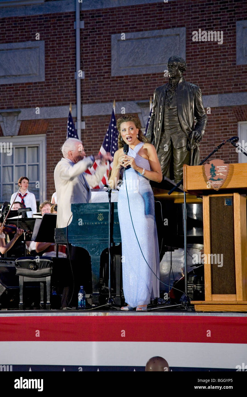Female vocalist performing with Peter Nero and the Philly Pops at historic Independence Hall, Philadelphia, Pennsylvania on July Stock Photo