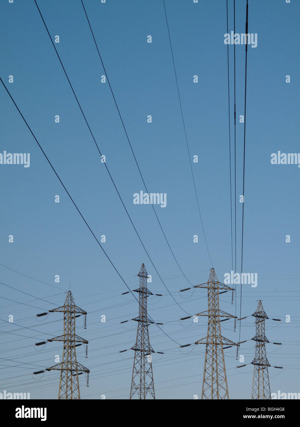 Electricity pylon against a blue sky Stock Photo - Alamy
