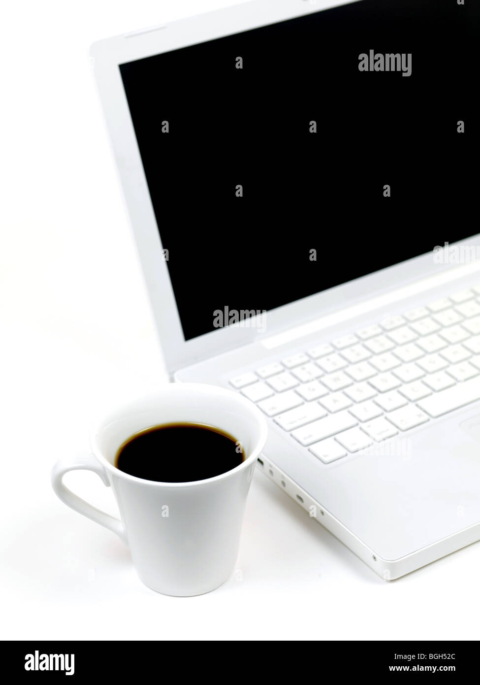 Cup Images Computer A laptop computer and a cup of coffee isolated against a white ...