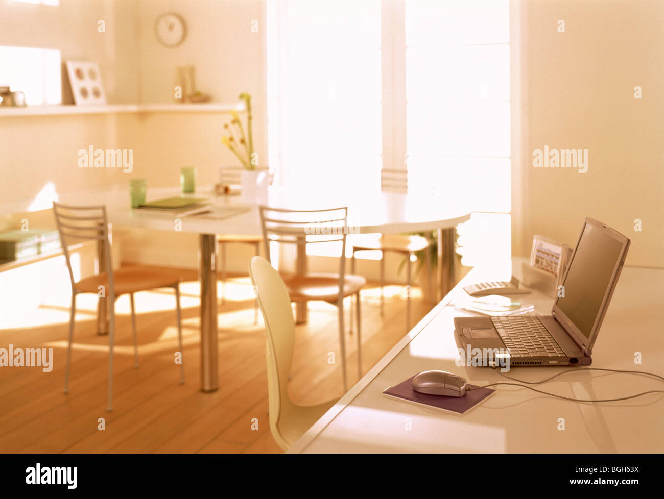 Table with laptop computer Stock Photo - Alamy