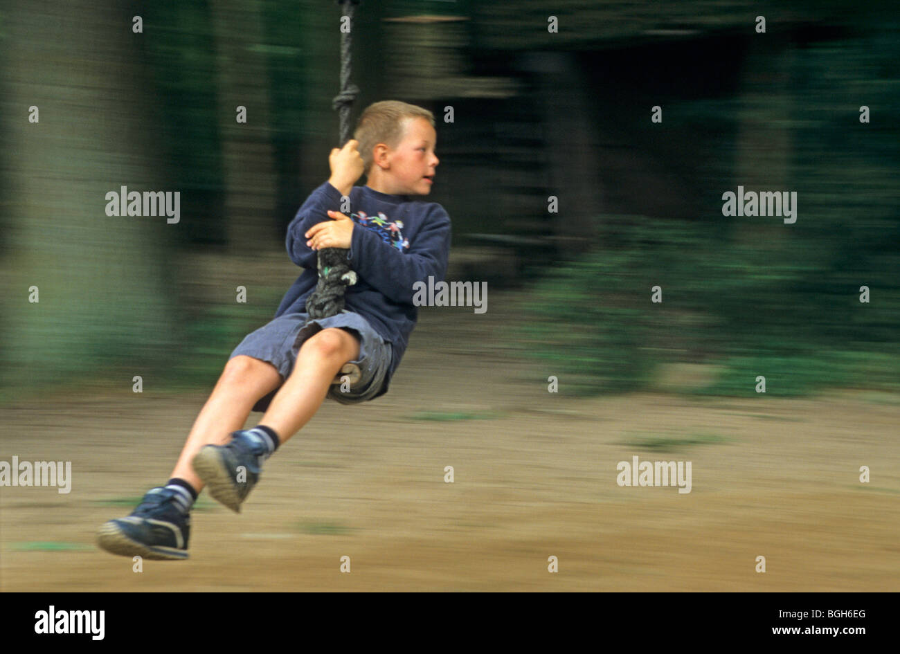 young boy on a rope slide Stock Photo Alamy
