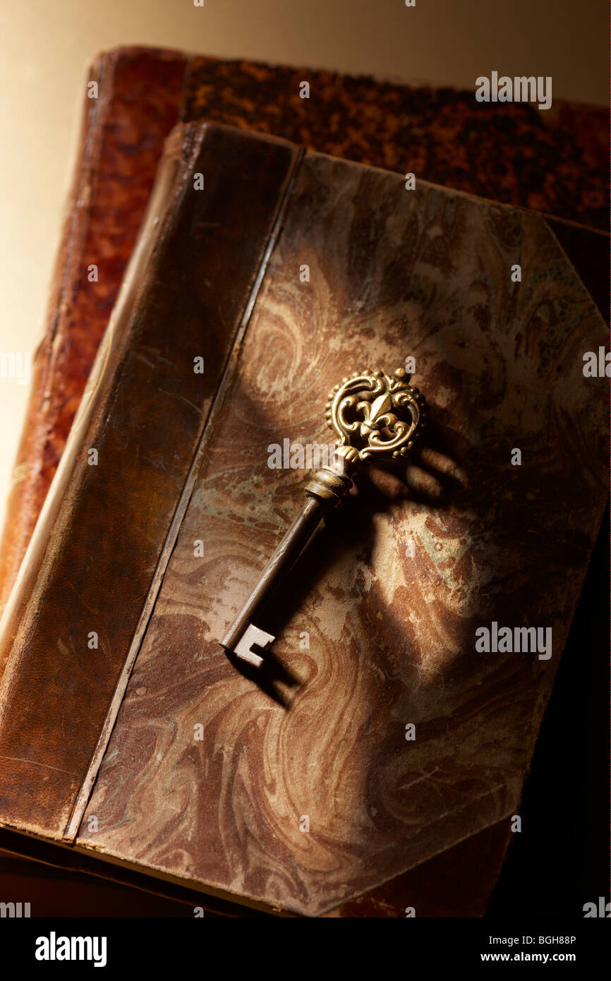 Antique key on books Stock Photo
