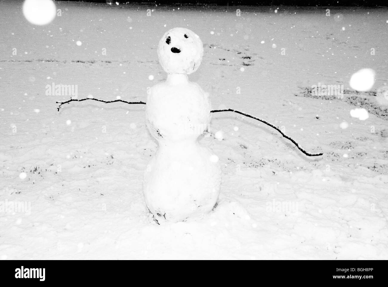 Hackney. London Fields. Snow.Snow man in park with snow falling Stock Photo