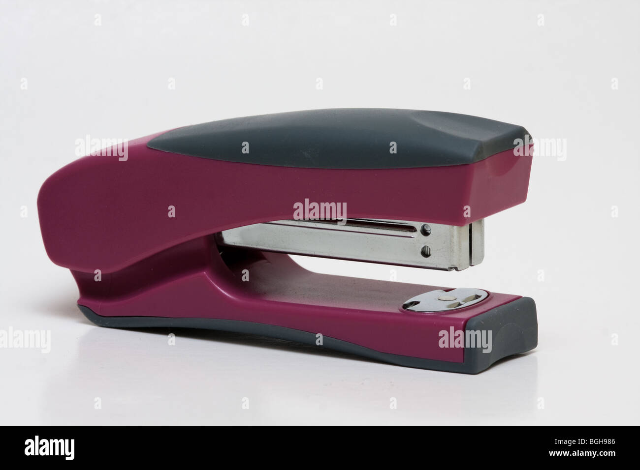 purple stapler office work business Stock Photo - Alamy