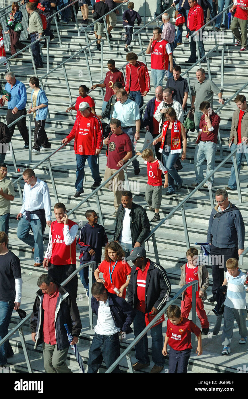 Football fans walking down steps at Arsenal's Emirates Stadium North