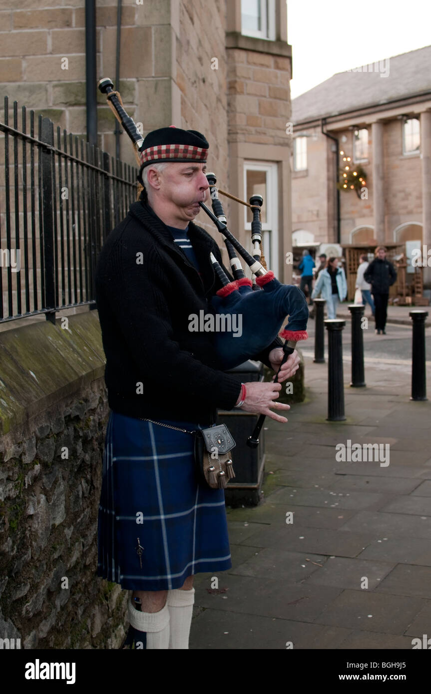 Bagpipe busker Bakewell Derbyshire Peak District England Stock Photo