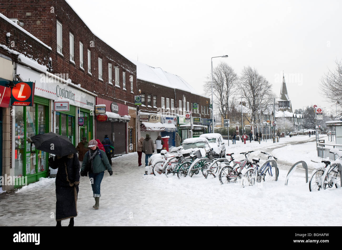 Christchurch Road from the Tube station in Colliers Wood, southwest London, in the snow Stock Photo