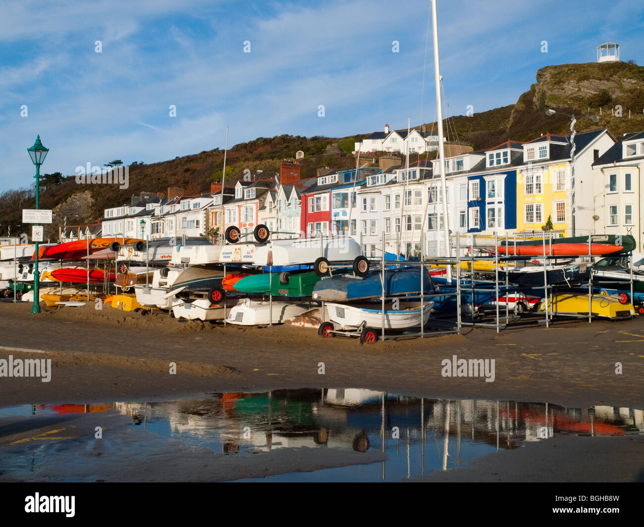 Boats reflected in water by the beach at Aberdovey (Aberdyfi), Gwynedd