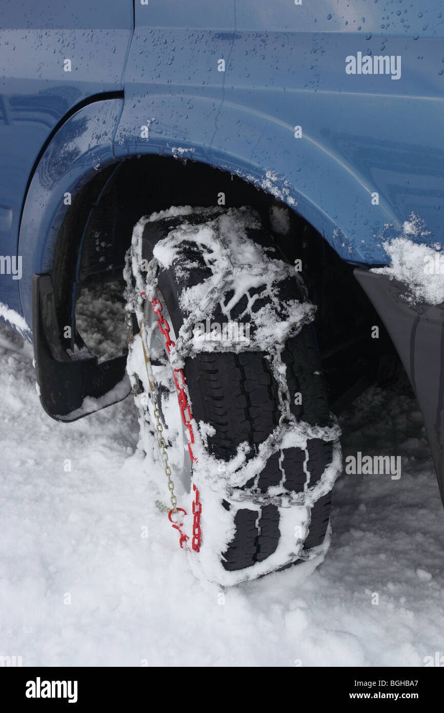 Snow Chains Fitted to a Vehicle Stock Photo