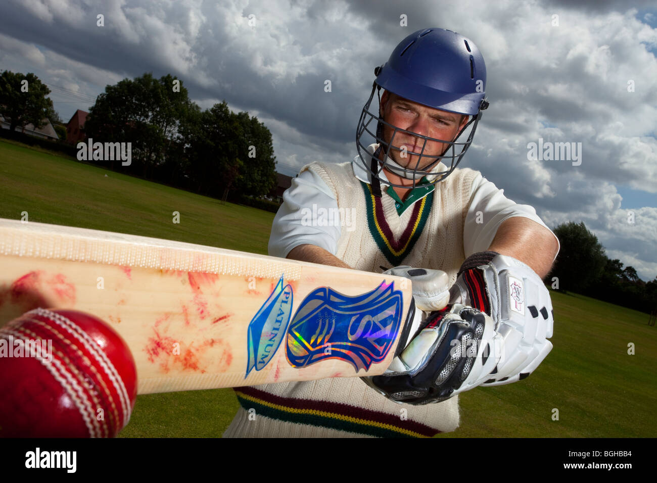 cricket player batsman ball bat Stock Photo