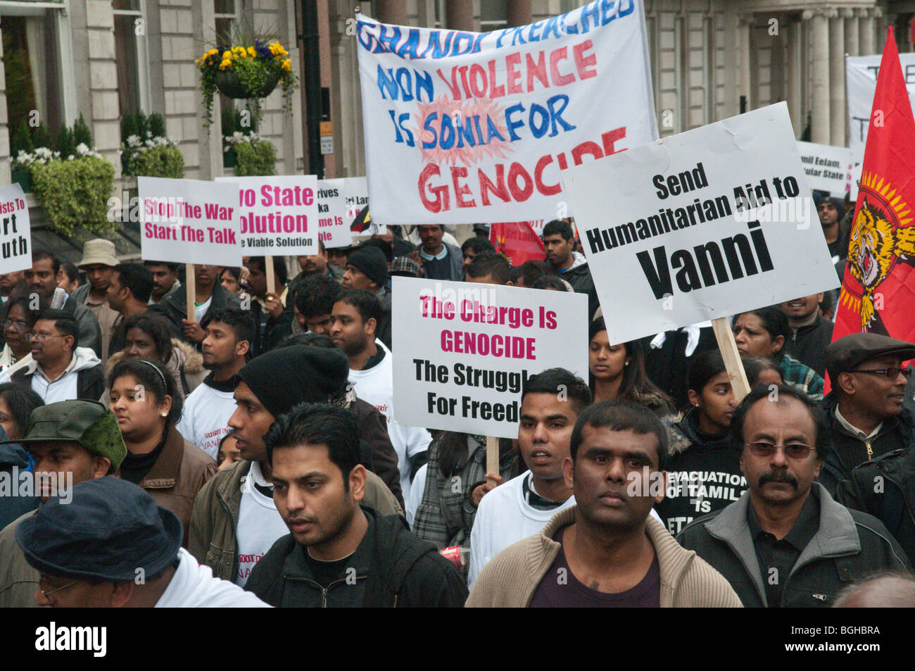 Placards in 100,000+ Tamil march through London in protest against the killing of civilians and Tamil Tigers in Sri Lanka Stock Photo