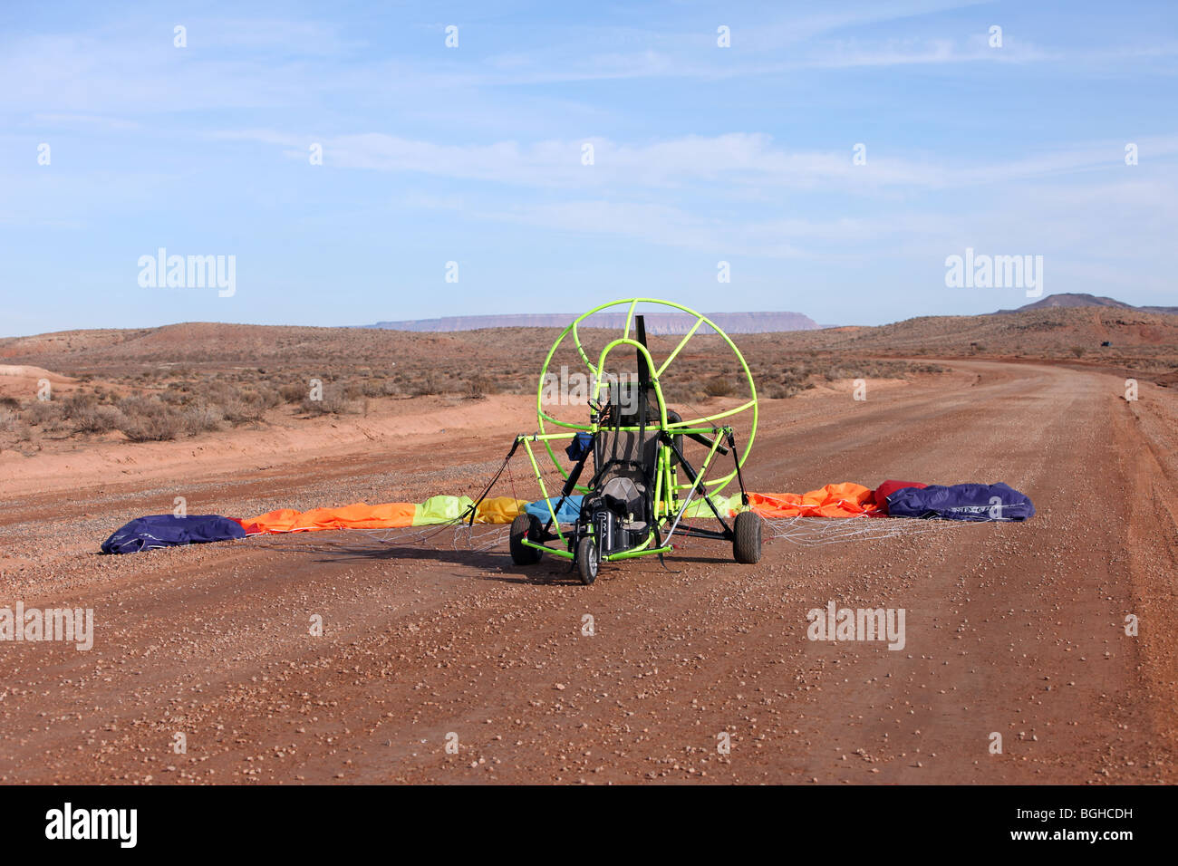 Power parachute pre-flight and ready for start and takeoff in the west desert area of Utah. Long open dirt road. Stock Photo