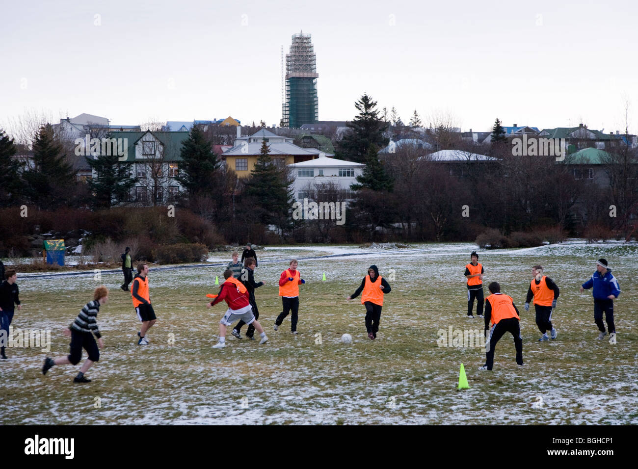 Boys in college 'Menntaskolinn in Reykjavik' playing soccer on a cold morning. Downtown Reykjavik, Iceland. Stock Photo