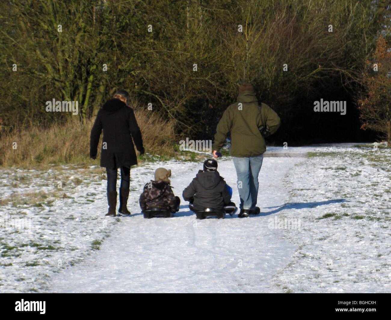 family in the snow Stock Photo - Alamy