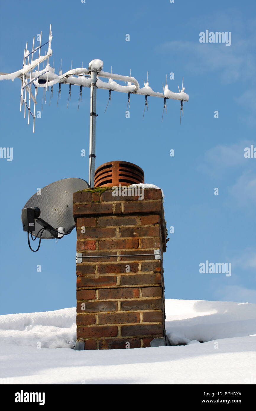 A TV aerial and Sky dish Stock Photo